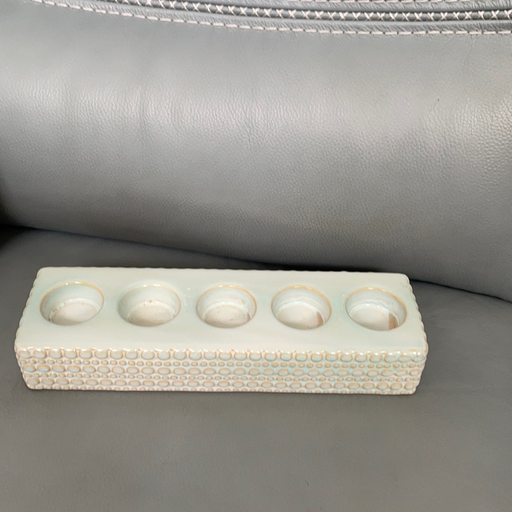 Candle ceramic holder. Great accent to table, holds 5 tea candles. Used no chips